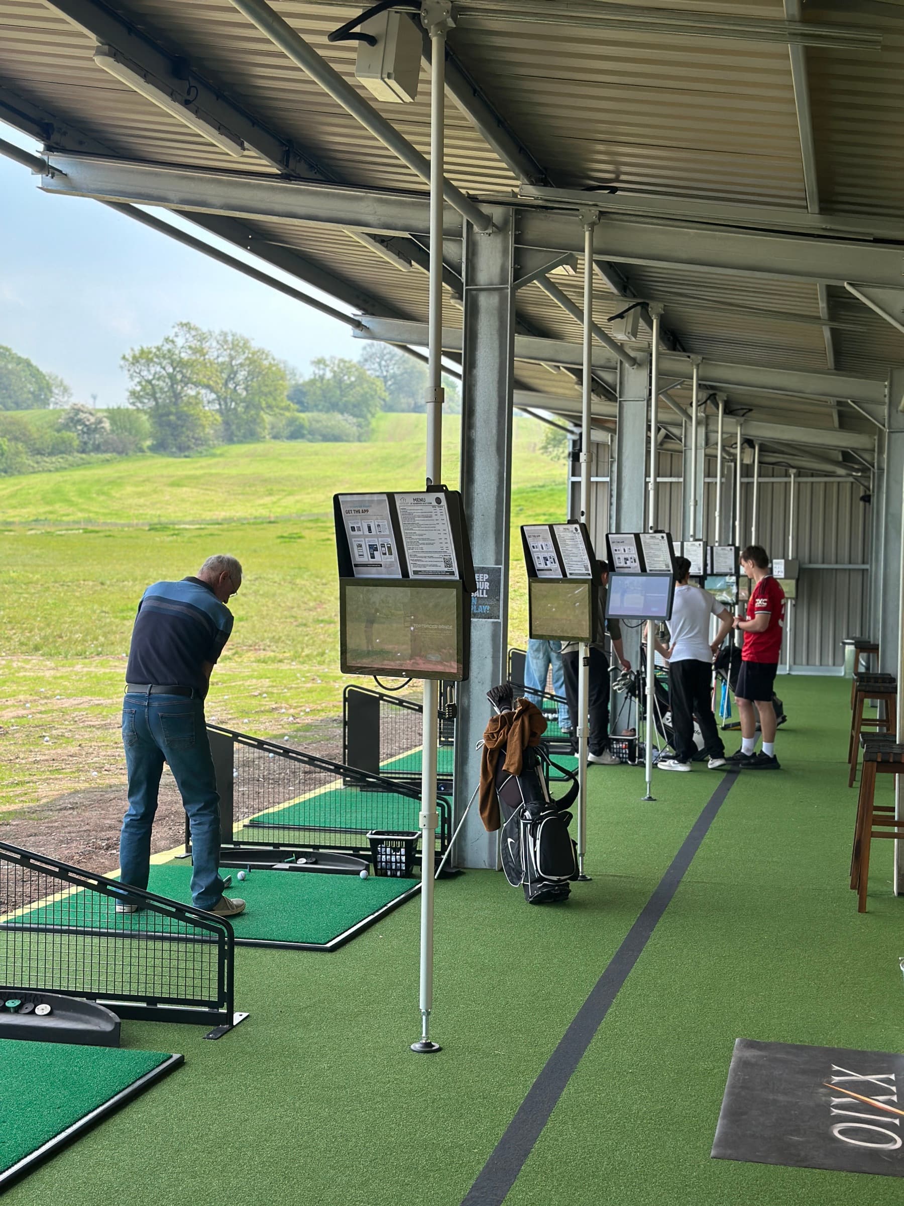 The covered, floodlit Toptracer bays at Ashbrook Golf Zone, ready for a group booking